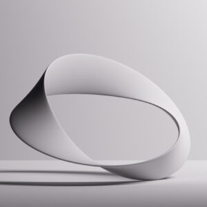 Un'illustrazione in grafica 3d che raffigura un anello di Moebius bianco poggiato sulla superficie di un tavolo bianco davanti a uno sfondo bianco. La luce sulla scena viene da un punto abbastanza vicino, in alto a destra, e proietta ombre sull'anello e sulla superficie del tavolo alla sua sinistra. Le ombre sull'anello rendono evidente la particolarità dell'anello di Moebius, che è poggiato sul tavolo in una posizione "impossibile", ovvero con una sola estremità, a destra, mentre tutto il volume dell'anello è a sinistra, fluttuante sopra la superficie del tavolo.